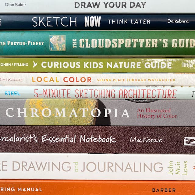 A colorful stack of inspiring books recommended by Art Toolkit.