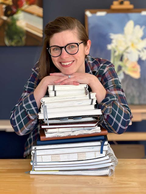 Portrait of Jill Gustavis with books.